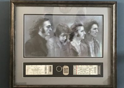 Beatles print with concert tickets.
