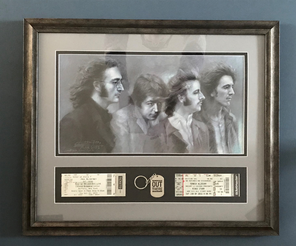 Beatles print with concert tickets.