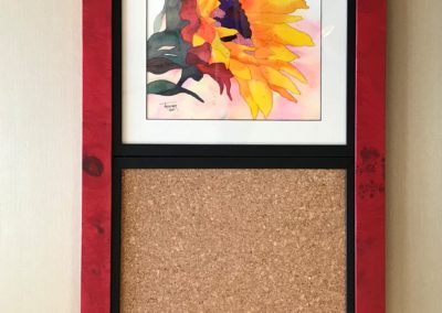 Watercolor painting paired with cork to make a personal cork board