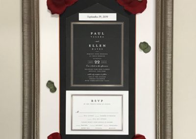 Wedding invitation with silk floral enhancements.