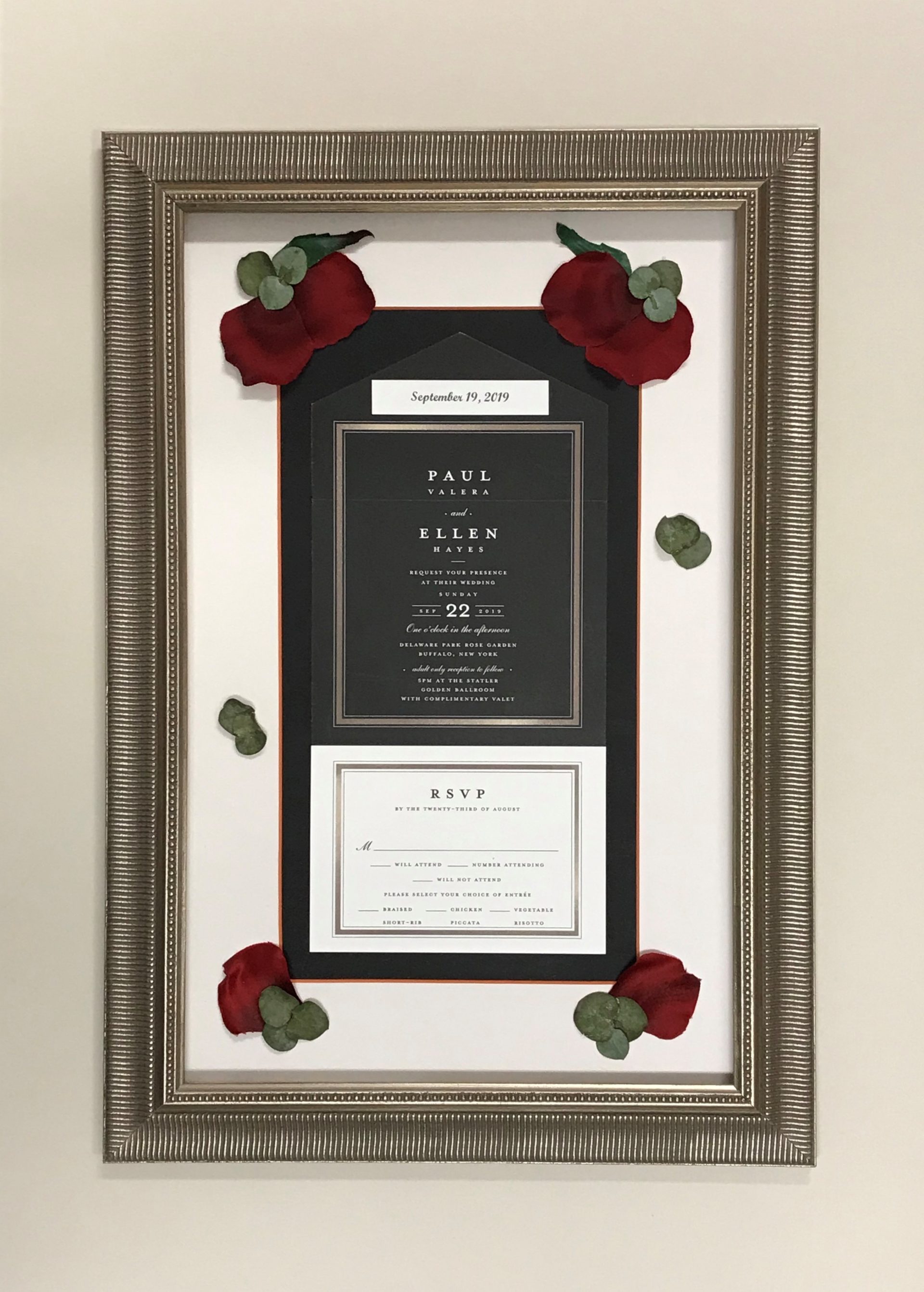 Wedding invitation with silk floral enhancements.